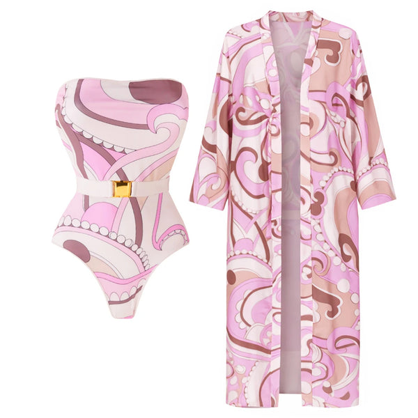 Pink and brown patterned swimsuit and robe set on a white background