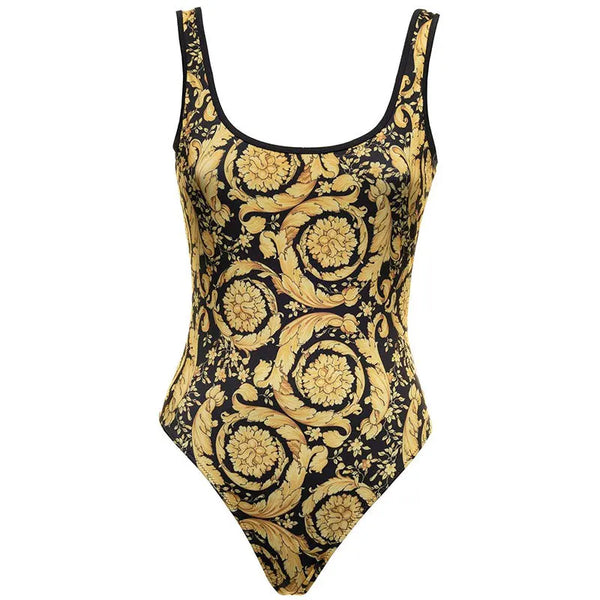 One-piece swimsuit with gold baroque pattern on a white background
