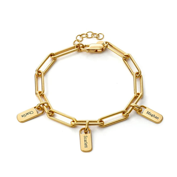 Gold chain bracelet with name tags on a white background