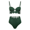 Green bikini set with scalloped edges on a white background