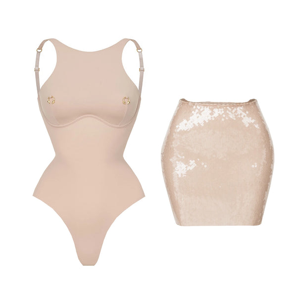 Beige bodysuit and sequin skirt on a white background