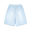 Light blue shorts with drawstring on a white background
