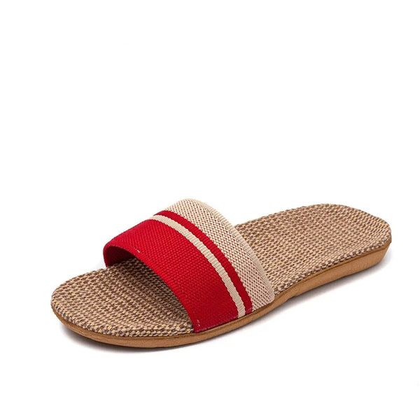 Beige sandal with a red strap on a white background