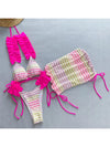 Colorful bikini set with pink straps on a gray background