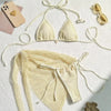 Beige bikini set with matching pouch on a light background