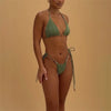 Green bikini set on a model against a beige background