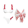 White bikini set with red coral patterns on a white background