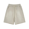 Beige shorts with drawstring on a white background