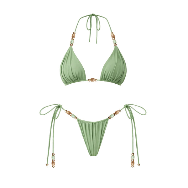 Green bikini set with beaded straps on a white background