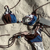 Bikini set on sand with ropes