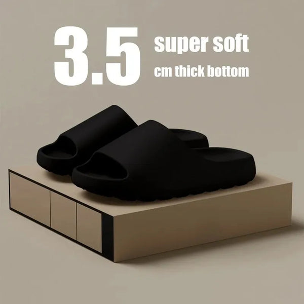 Black slides on a beige platform with text indicating '3.5 super soft cm thick bottom' on a beige background