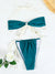 Teal bikini set with white straps on a light background