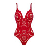 Red swimsuit with white floral pattern on a white background