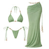 Green bikini set with matching long skirt on a white background