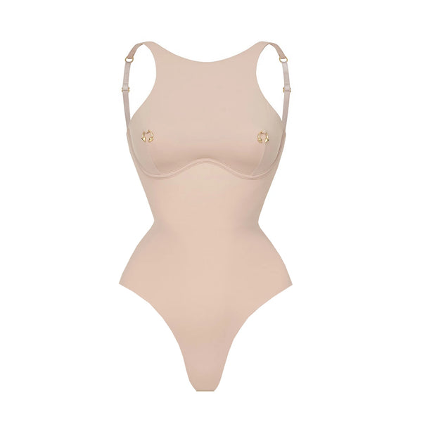 Beige bodysuit with thin straps on a white background