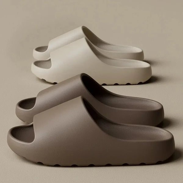 Pair of beige sandals on a beige background