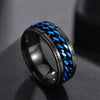 Black and blue braided ring on a dark surface