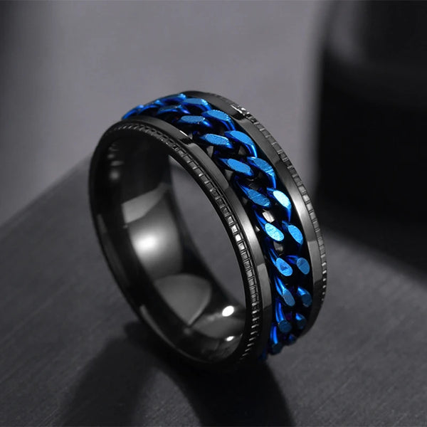 Black and blue braided ring on a dark surface