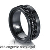 Black metal ring with engraved design on a white background