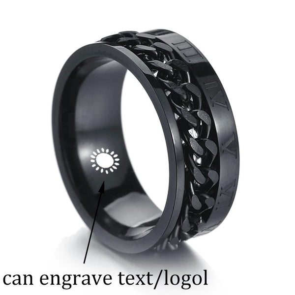 Black metal ring with engraved design on a white background