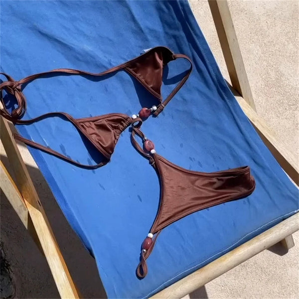 Brown bikini set on a blue lounge chair