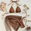 Brown bikini set with matching cover-up on a light background