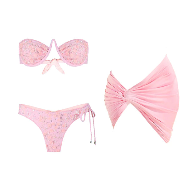 Pink bikini set with floral details on a white background