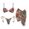 Colorful bikini set with matching sarong on a white background