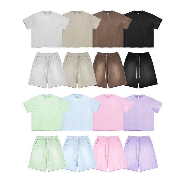 Collection of t-shirts and shorts in various colors on a white background