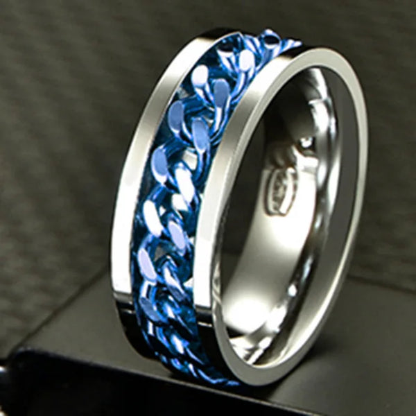 Silver ring with blue carbon fiber inlay on a dark background