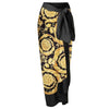 Black and gold patterned skirt with a tie waist on a white background