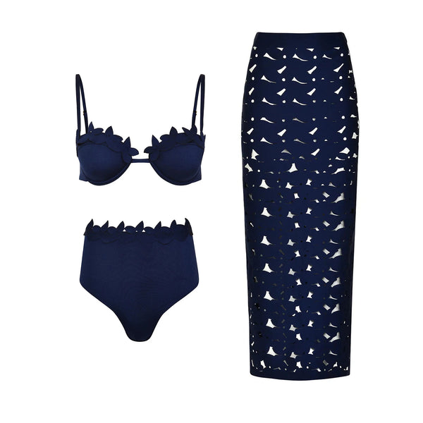 Navy blue bikini set with high-waisted bottoms and a matching skirt with white pattern on a white background.