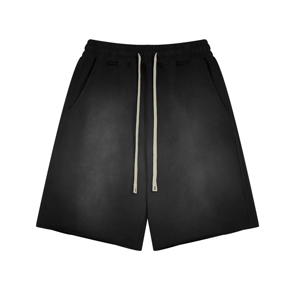 Black shorts with a drawstring on a white background