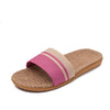 Slipper with pink and beige strap on a white background