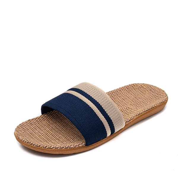 Beige sandal with a blue strap on a white background