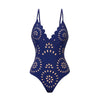 Navy blue swimsuit with floral cut-out design on a white background