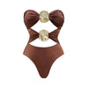 Brown swimsuit with decorative elements on a white background