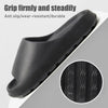 Black slipper with textured sole on a gray background, featuring text about grip and durability.