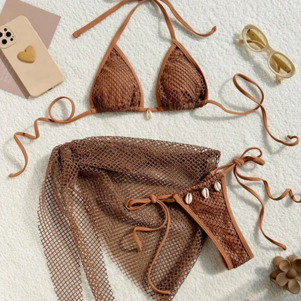 Brown bikini set with mesh details on a textured surface.