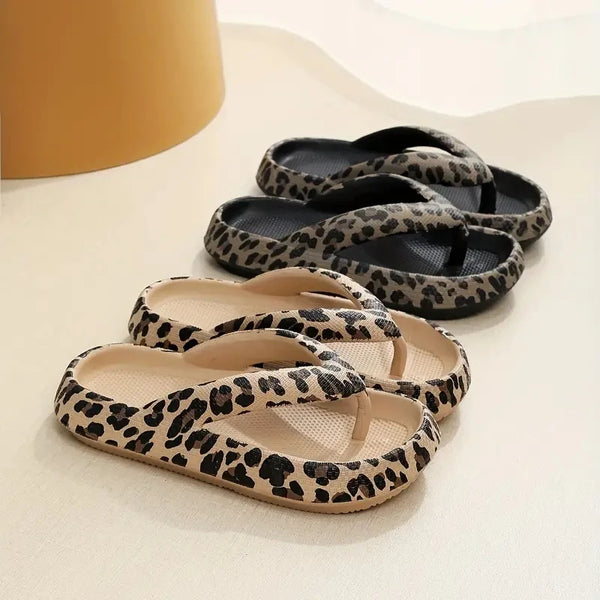 Pair of leopard print sandals on a light surface