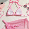 Pink bikini set with mesh string on a light background