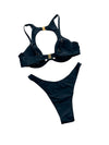 Black bikini set with gold accents on a light gray background, featuring the brand 'Varleinsar'.