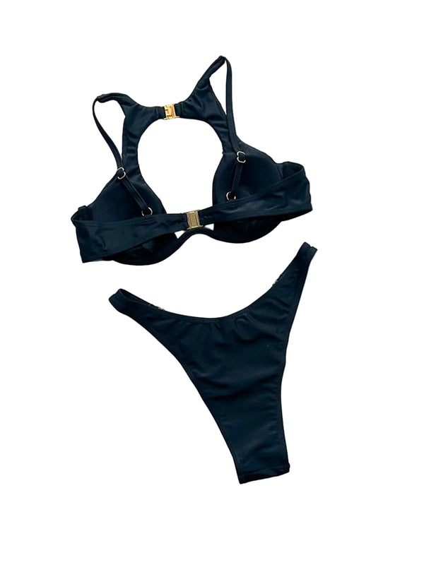 Black bikini set with gold accents on a light gray background, featuring the brand 'Varleinsar'.
