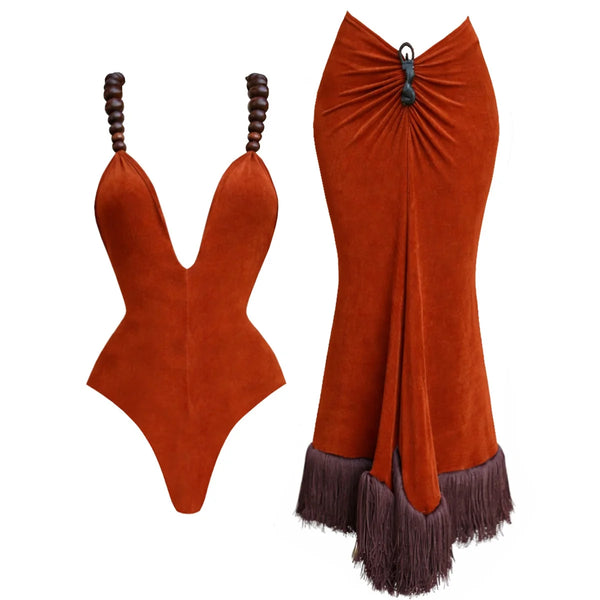 Orange swimsuit with fringed skirt on a white background