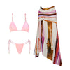 Pink bikini set and colorful skirt on a white background