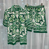 Green and white patterned shirt and shorts set on a white background