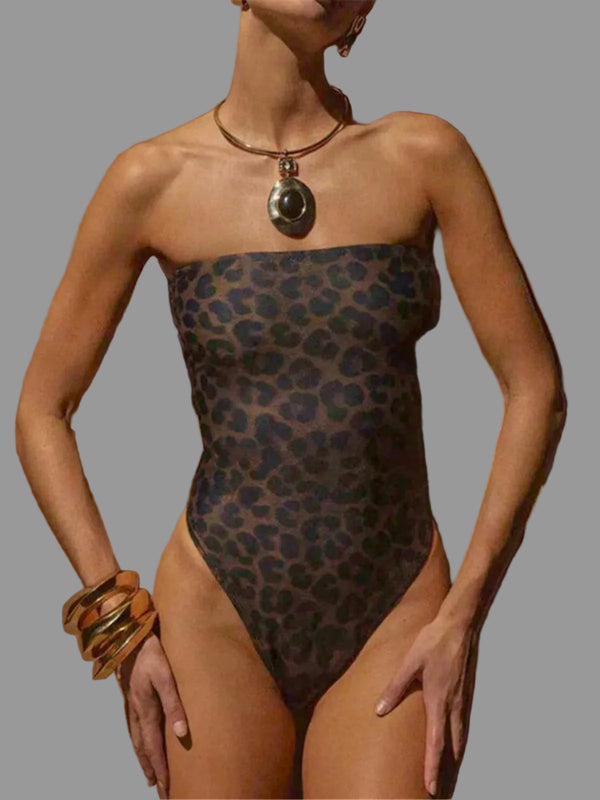 Person wearing a leopard print swimsuit with 'Varleinsar' branding.