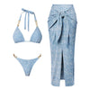Blue bikini set with matching sarong on a white background