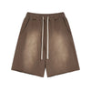 Brown shorts with a drawstring on a white background